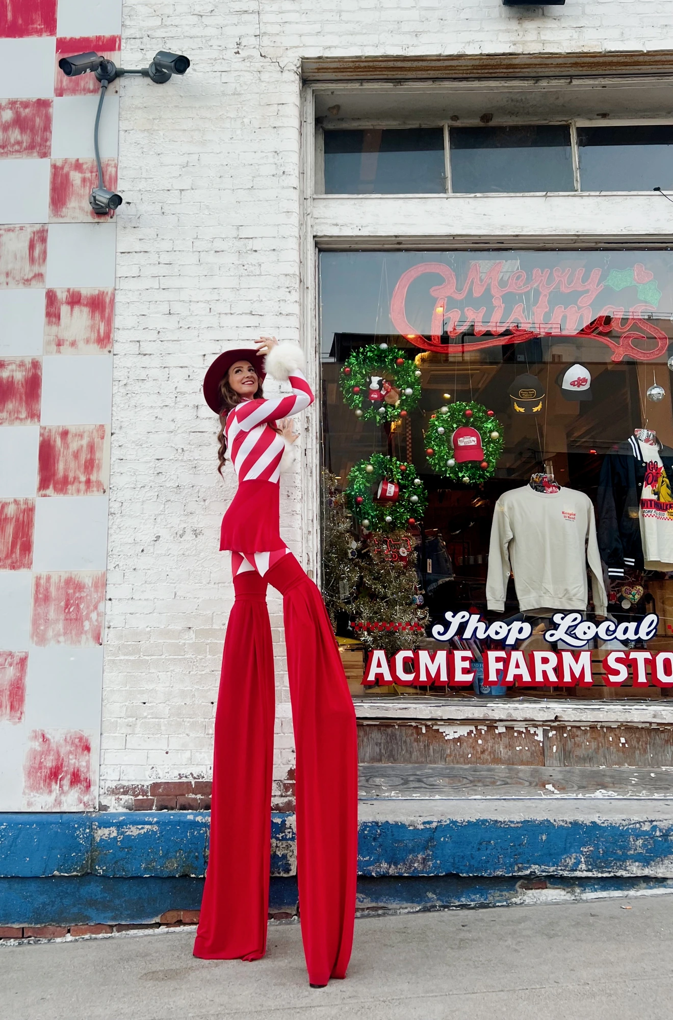 Sarah Grace stilt walking outside Acme Feed and Seed in downtown Nashville